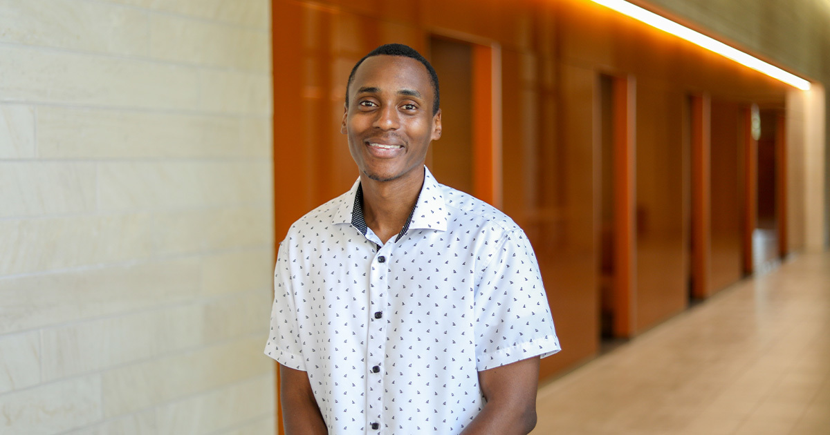 Balford, an MS patient at UT Health Austin, smiles at the camera.