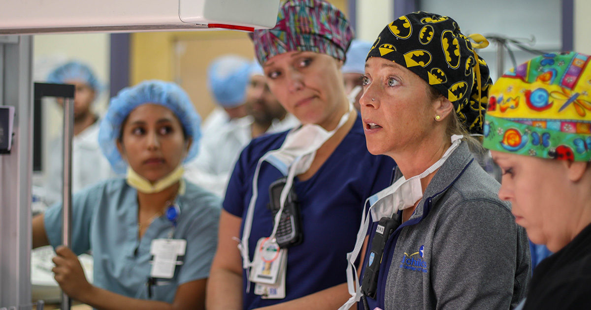 A UT Health Austin surgical team in conversation.