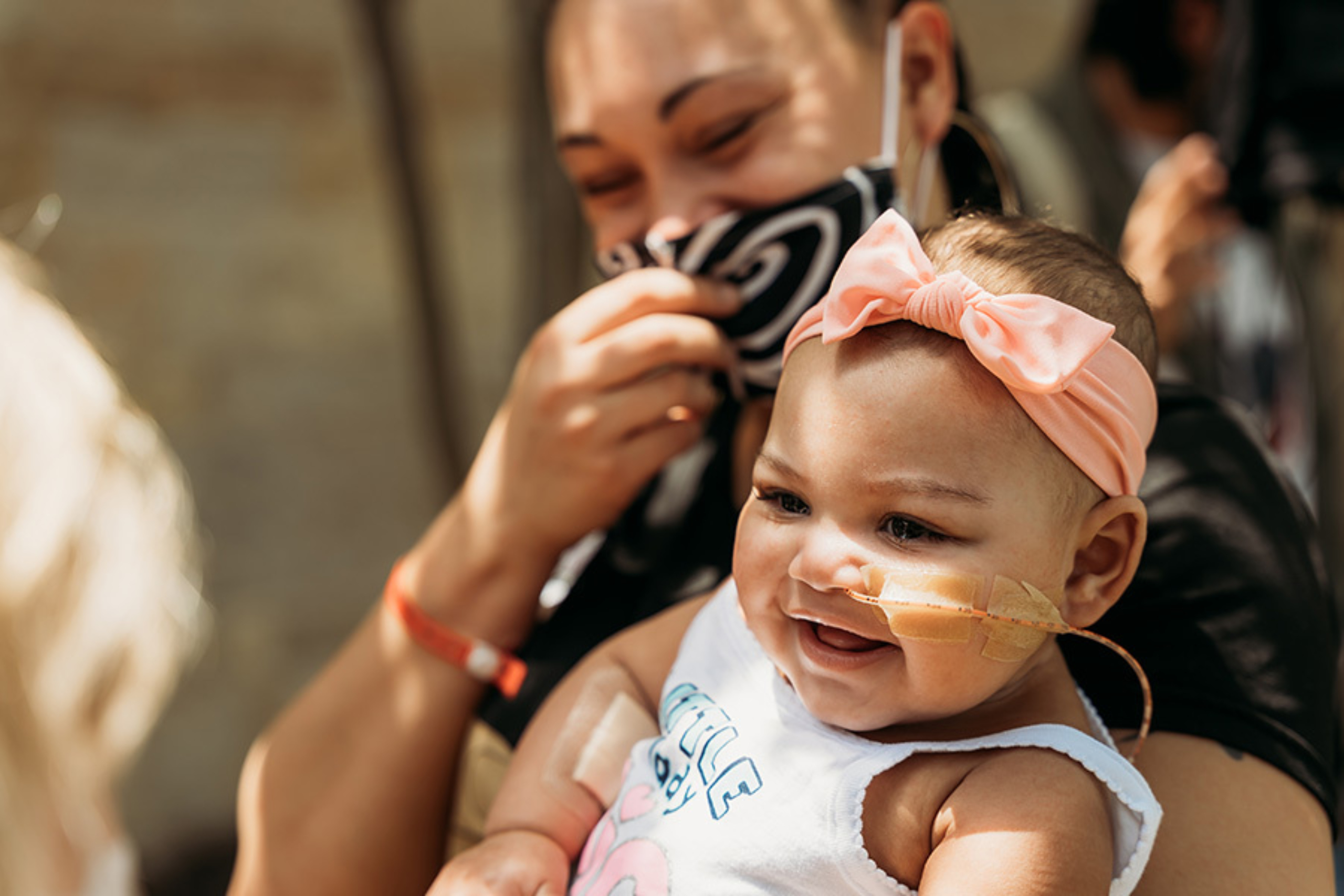 Zaria Jackson smiling in her mother's arms after being discharged from Dell Children's Medical Center