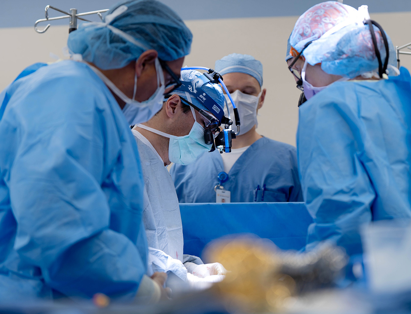 Surgeons performing a partial pediatric heart transplant.