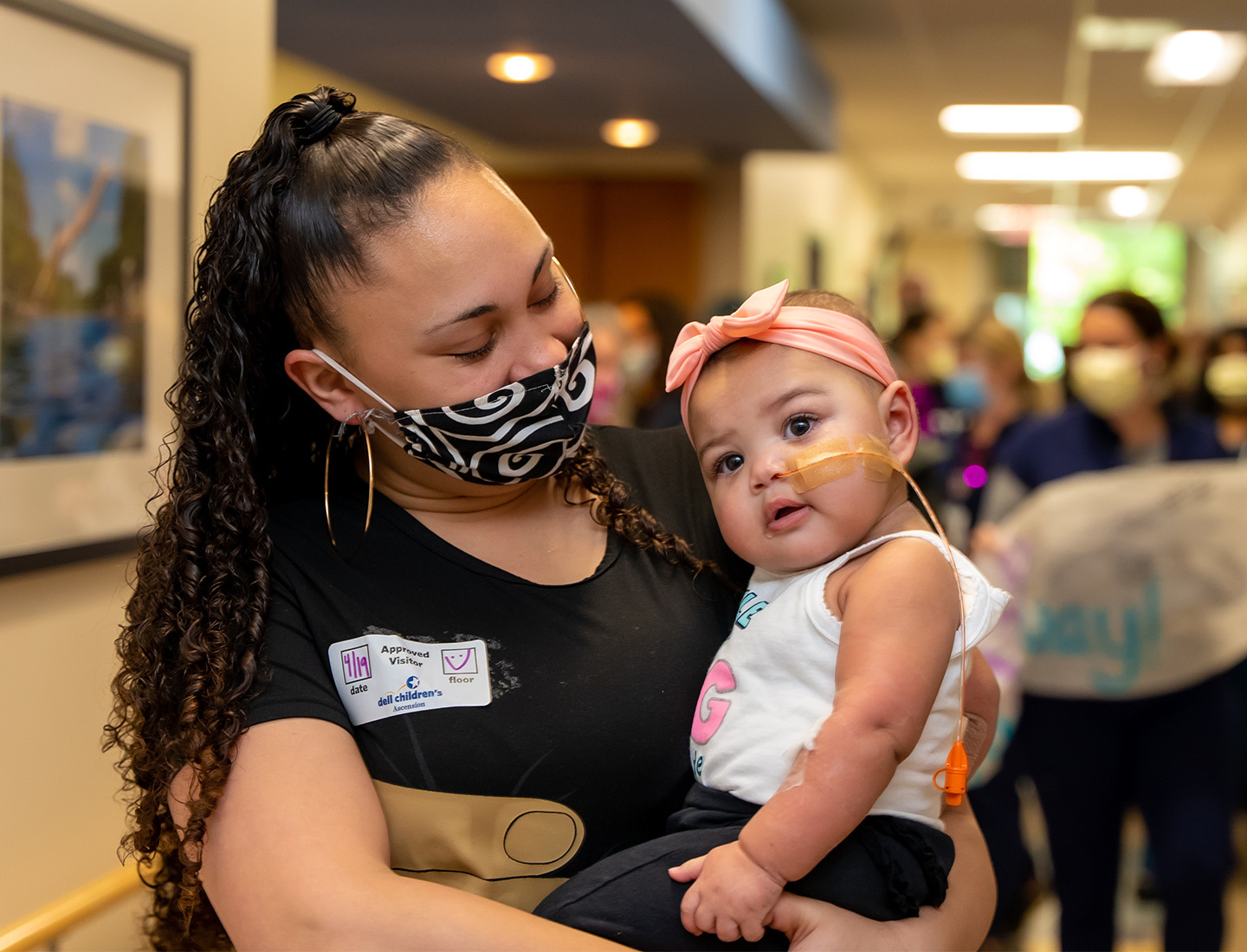 Zaria Jackson held by her mother after recovering from heart surgery