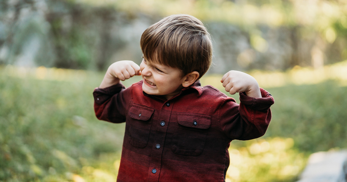 4-year-old boy (Levi Reeves) flexing his biceps
