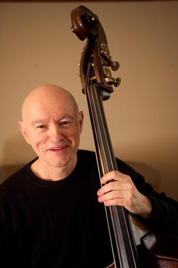 Mark Bernat, Director of the Dell Medical School Red River Ensemble, is featured with his cello.