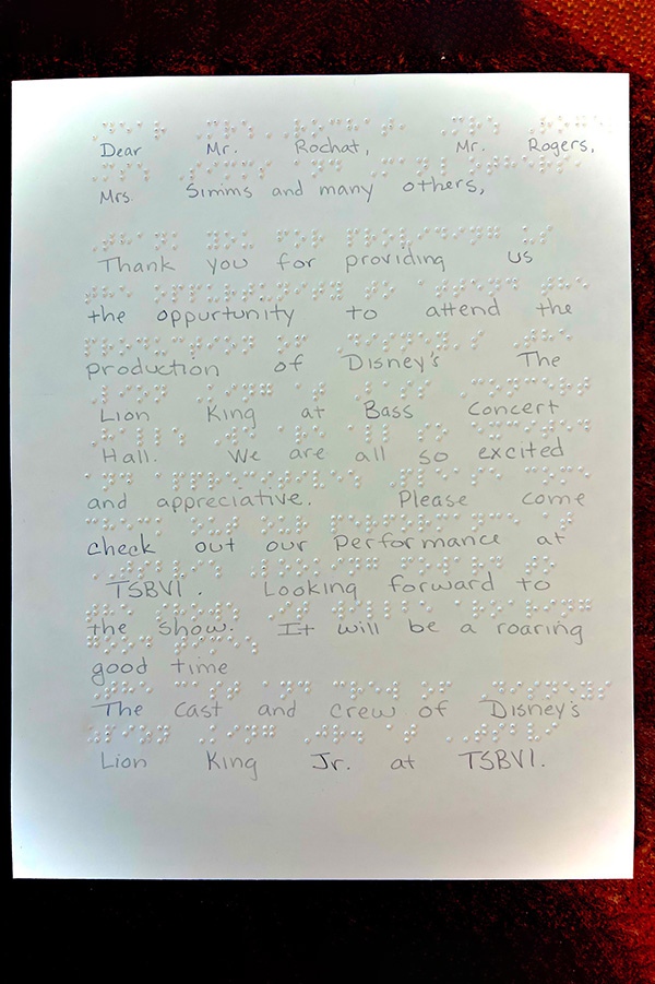 Thank you letter, in Braille and printed letters, for the medical students who put together the Lion King event for students at the Texas School for the Blind and Visually Impaired in Austin, TX.