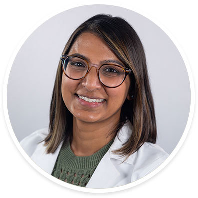 A portrait of Veena Patel, MD, rheumatologist, in a round frame.