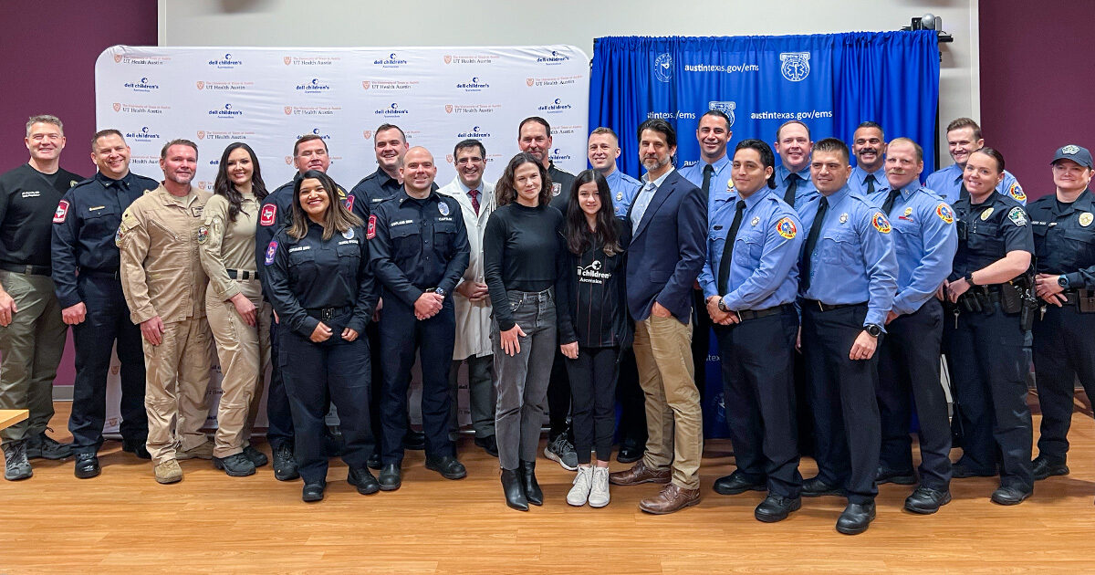 Sabine Barrett surrounded by her family, Dr. Carlos M. Mery, her soccer coach, and first responders.