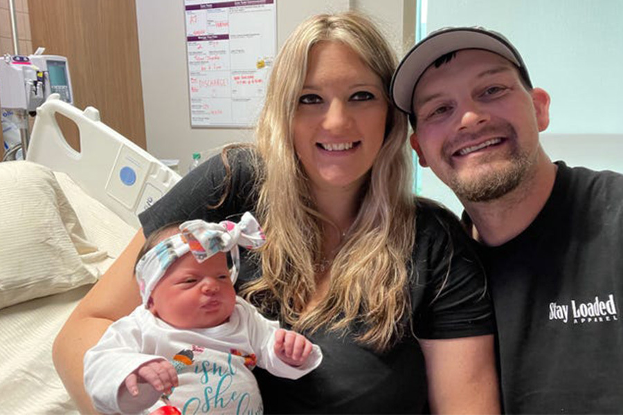 Shelby Herrington and Logan Wade hold their daughter Paisley, the first baby born in the new Dell Children’s Specialized Delivery Unit (SDU).