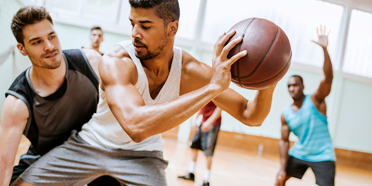 Men playing basketball