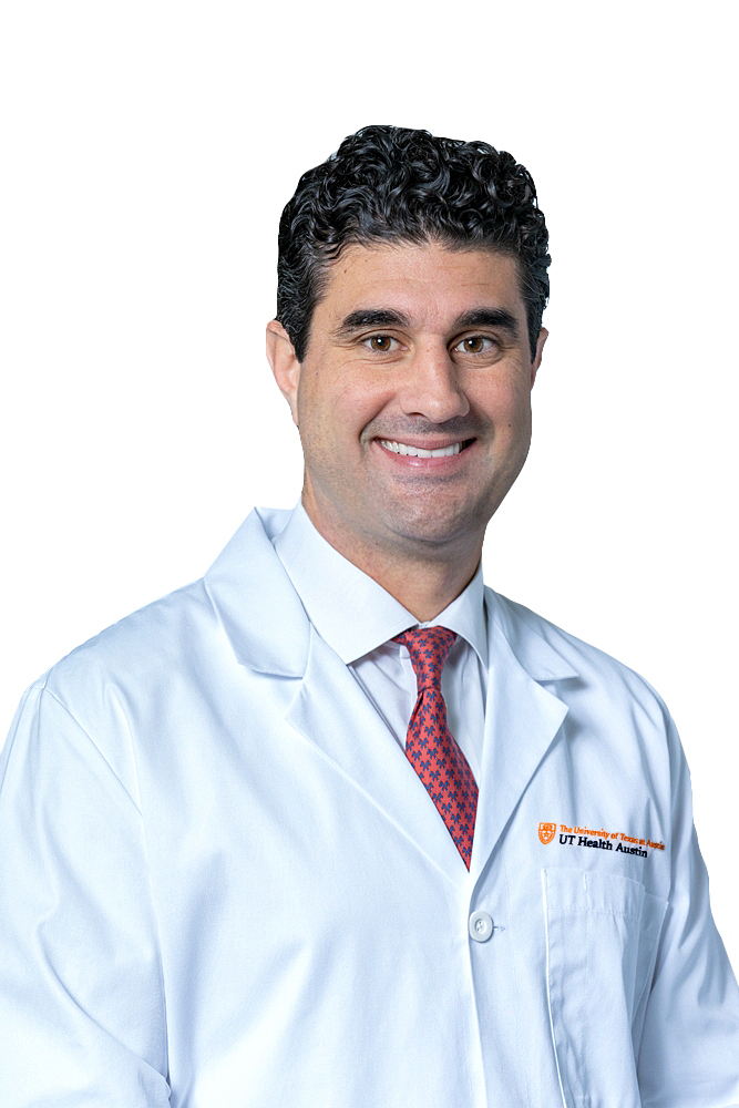 Cardiothoracic surgeon George Arnaoutakis, MD, wearing a white coat and smiling in front of a white backdrop.