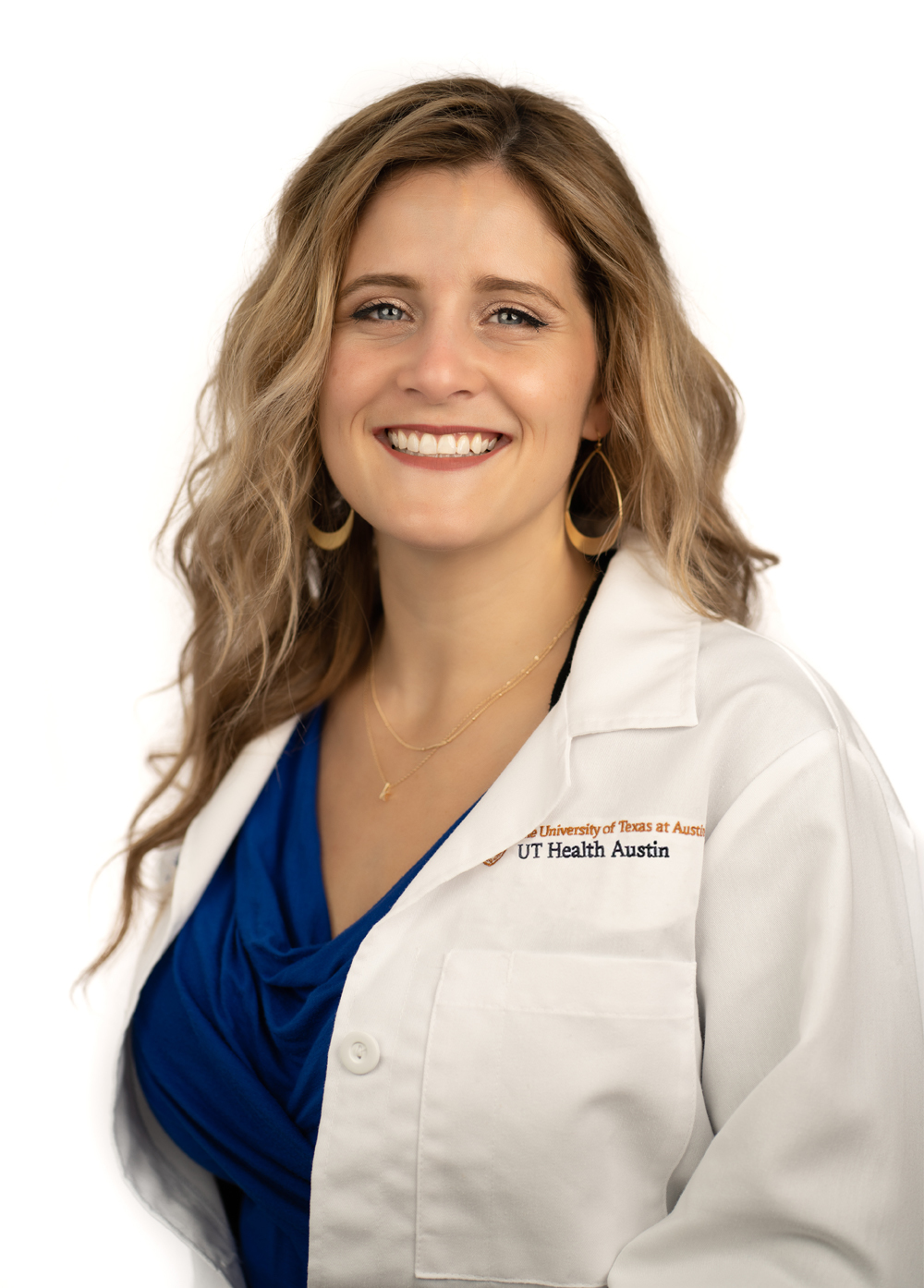 Nurse practitioner Kari LeBret-Harris MSN, APRN, FNP-C, wearing a white coat and smiling in front of a white backdrop.