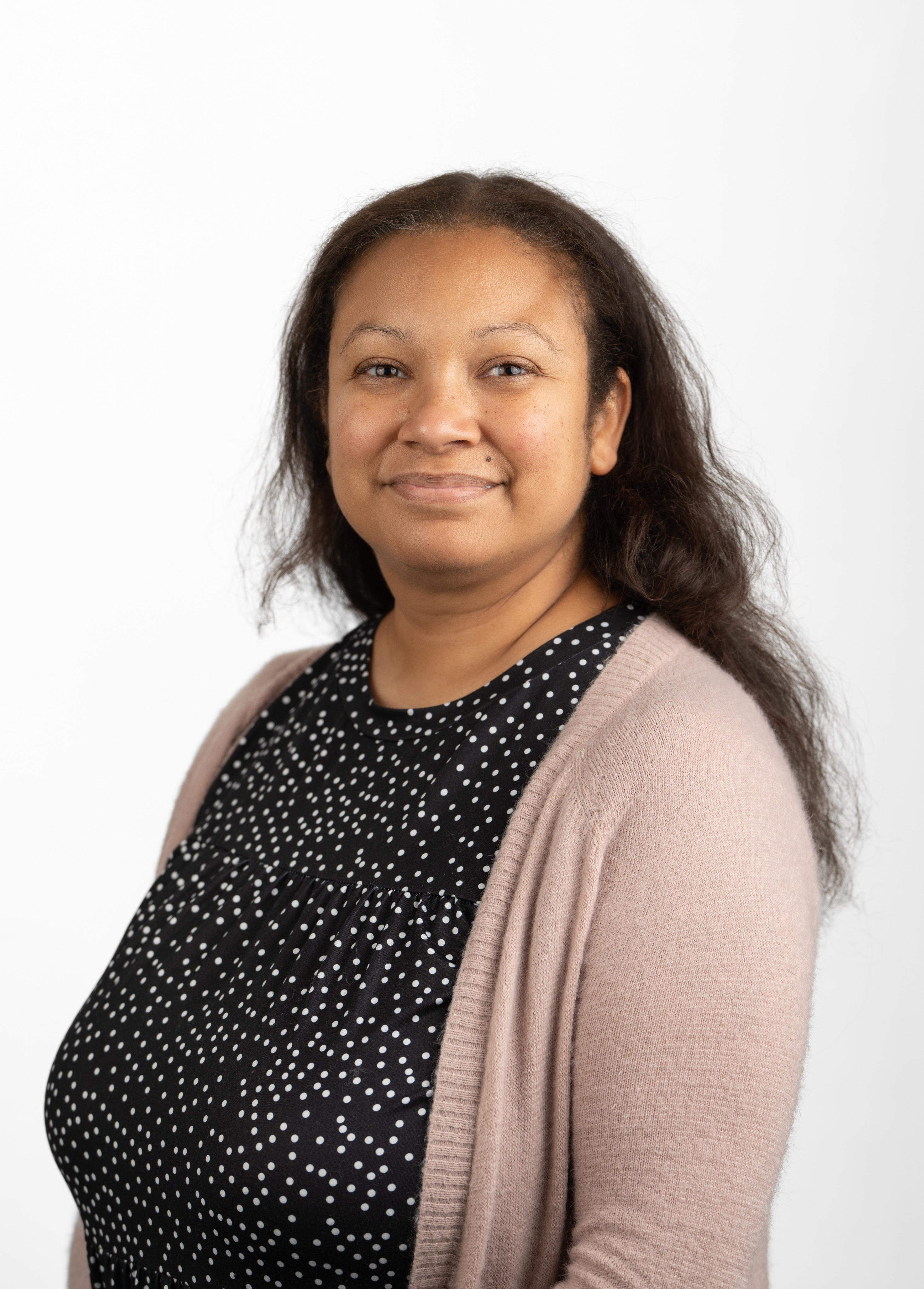 Social worker Lisa McDermott, LCSW-S, wearing a cardigan and smiling in front of a white background.