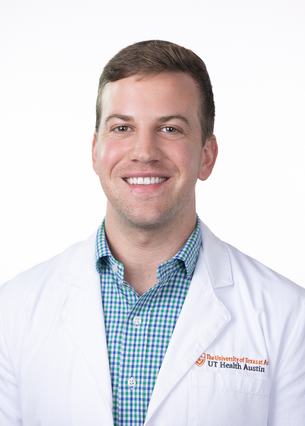 Dr. Patrick LaBrode is wearing a white coat and smiling at the camera.